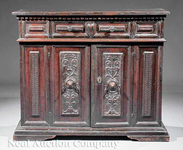 Appraisal: An Antique Italian Carved Walnut Cupboard th c the whole