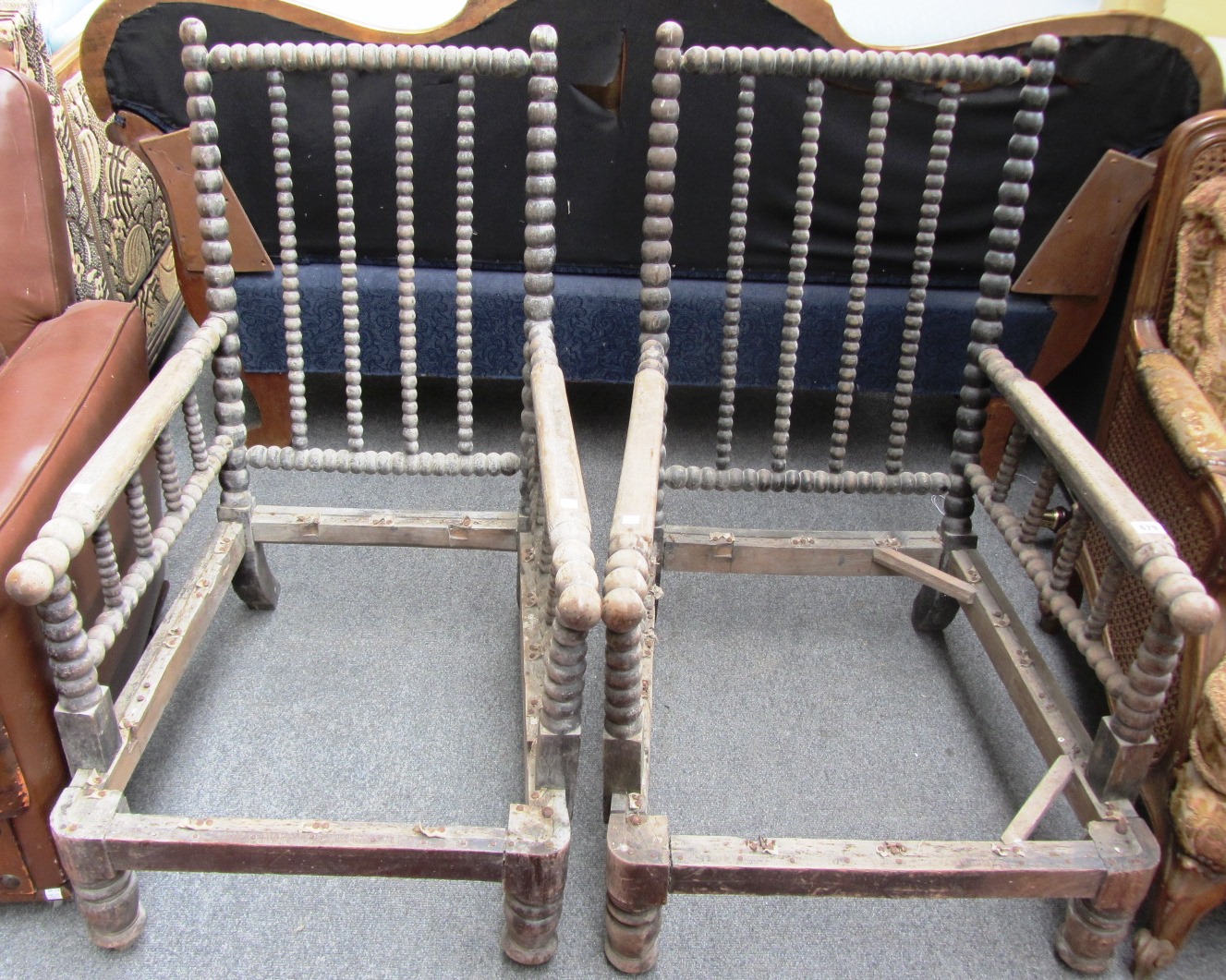 Appraisal: A pair of th century bobbin turned beech easy armchairs