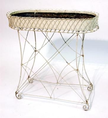 Appraisal: A WIRE WORK PLANT STAND of rounded oblong form with