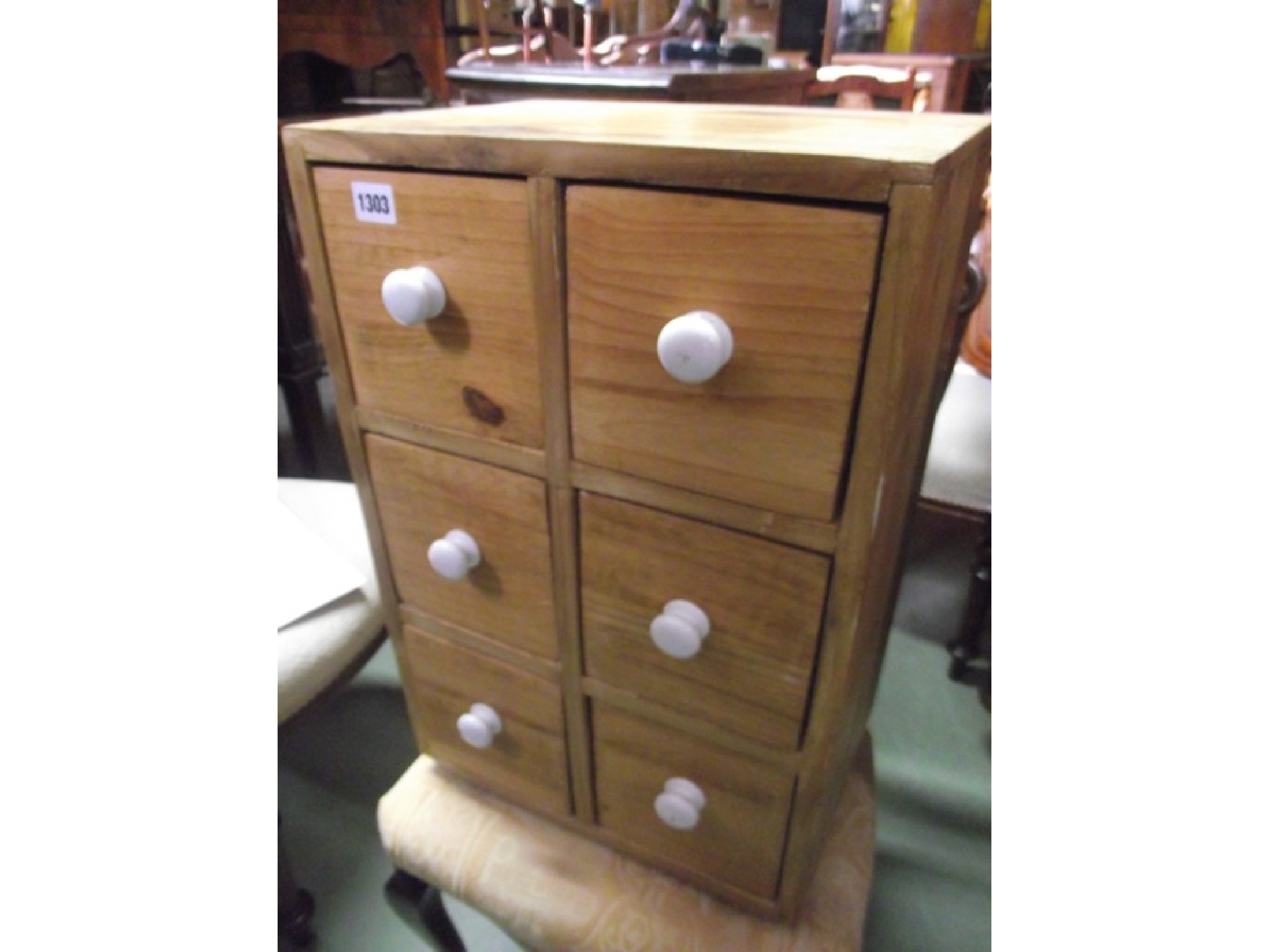 Appraisal: A small stripped pine bank of six deep drawers with