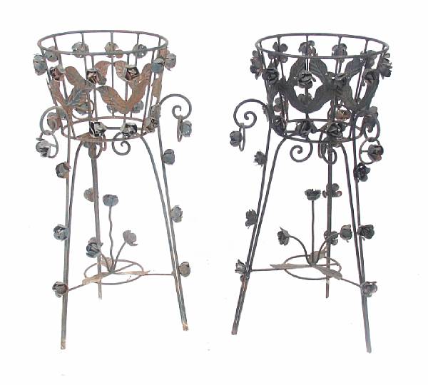 Appraisal: A group of four wrought iron and tole planters height