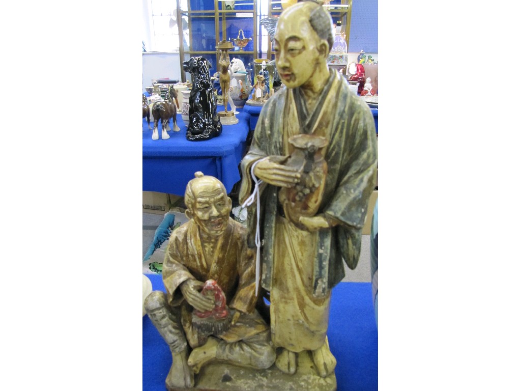 Appraisal: Painted plaster figure group of two oriental men