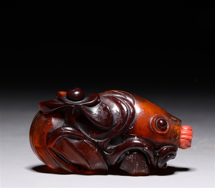 Appraisal: Chinese carved amber like possibly composite snuff bottle in the