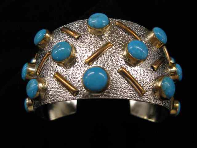 Appraisal: Mark Yazzie Indian Bracelet sterling with rich turquoise gold-filled trim