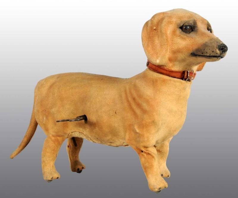 Appraisal: De Camp Clockwork Dachshund Dog Toy Description Soft cloth covered