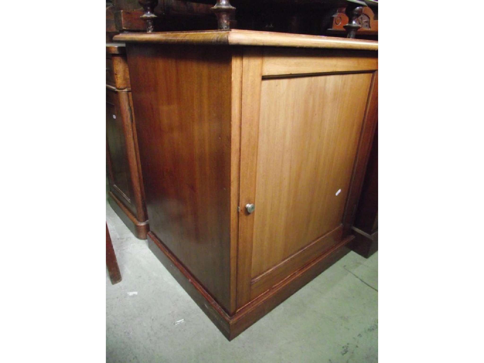 Appraisal: A low th century mahogany side cupboard of pedestal form