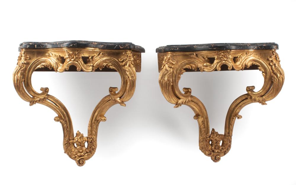 Appraisal: Pair of Louis XV-Style Carved Giltwood Consoles each with serpentine