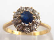 Appraisal: A yellow metal tests carat gold sapphire and diamond ring