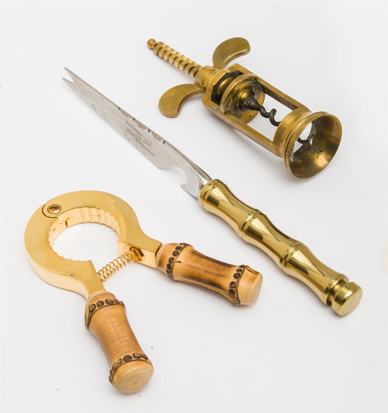 Appraisal: GROUP OF BAR IMPLEMENTS Comprising a brass corkscrew and bottle