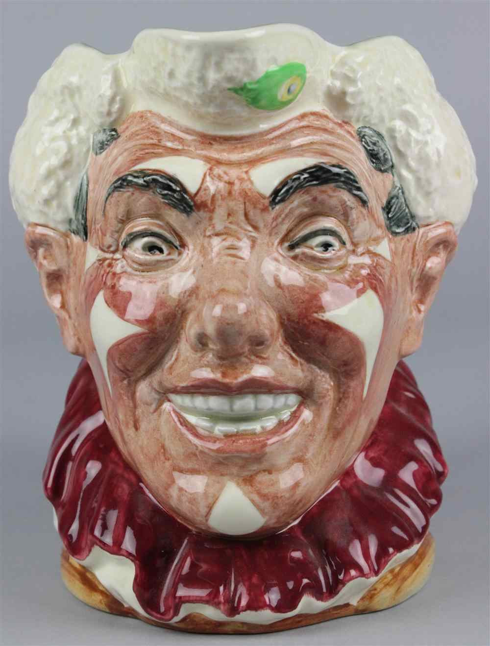 Appraisal: ROYAL DOULTON 'THE CLOWN' CHARACTER JUG copr multicolored with white