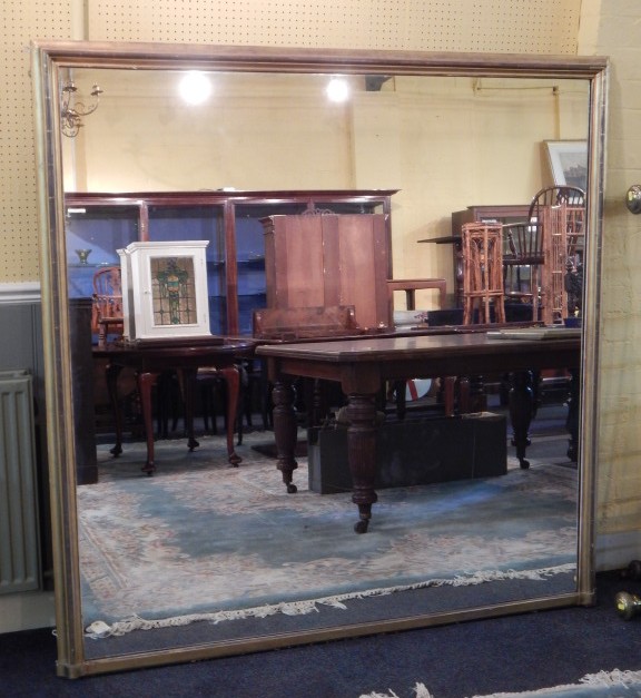 Appraisal: A thC gilt rectangular overmantel mirror with a moulded frame