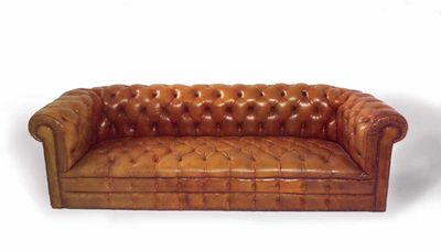 Appraisal: A Chesterfield button-back settee upholstered in brown leather cm in