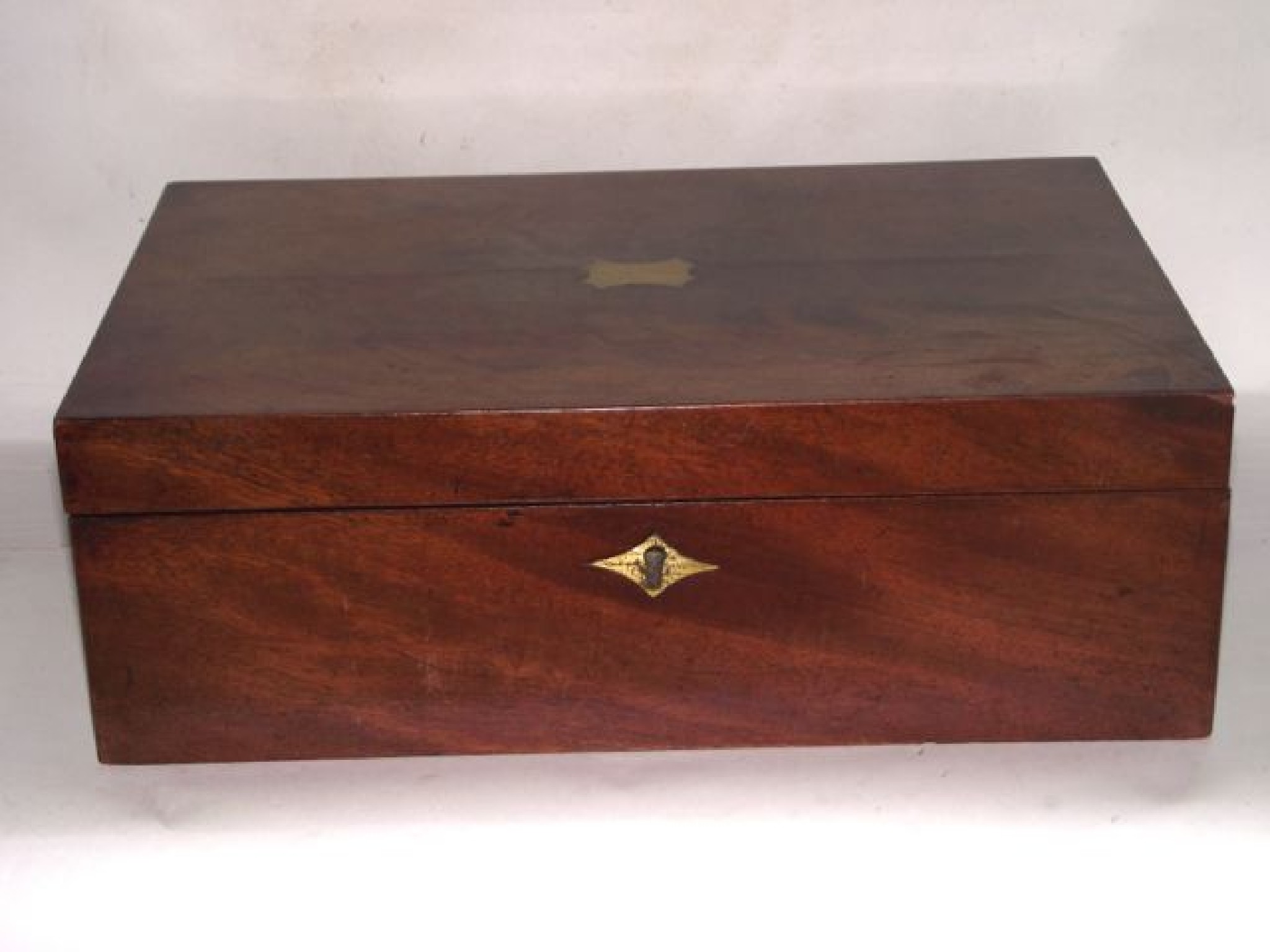 Appraisal: A th century mahogany veneered writing slope the hinged lid