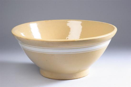 Appraisal: AMERICAN YELLOW WARE BOWL th century Decorated with three white