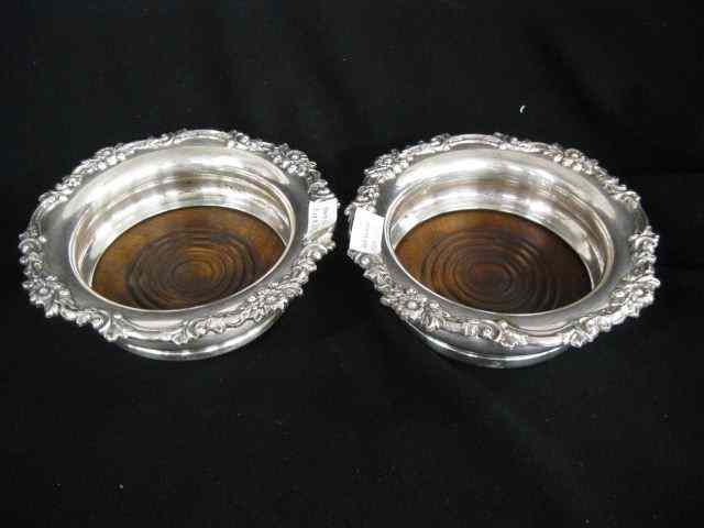 Appraisal: Pair of Silverplate Wine Coasters ornate floralborder wood lined ''