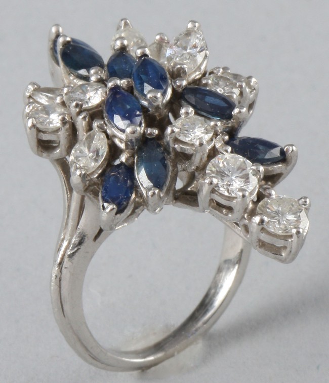 Appraisal: Ring features sapphires five ctw diamonds seven ctw round diamonds