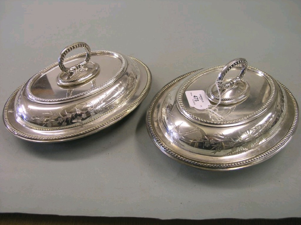 Appraisal: A pair of late Victorian silver plated entree dishes oval