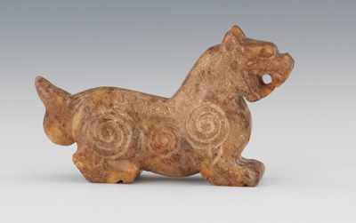 Appraisal: A Carved Jade Lion Ornament Carved in archaic style jade