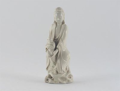 Appraisal: A Chinese blanc de Chine figure of Guanyin seated on