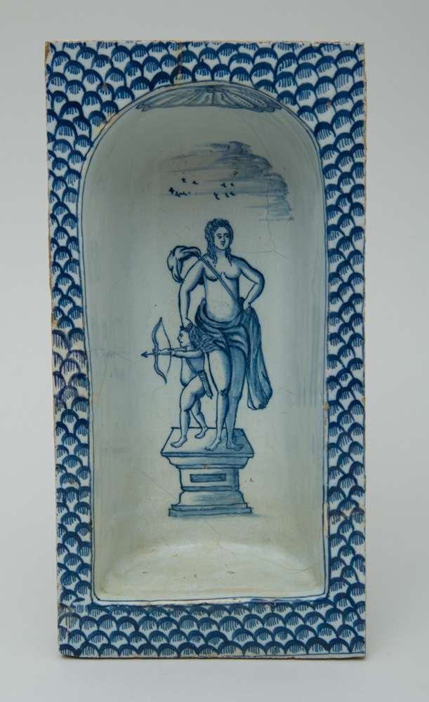 Appraisal: CONTINENTAL FAIENCE BLUE AND WHITE NICHE The curved back recess