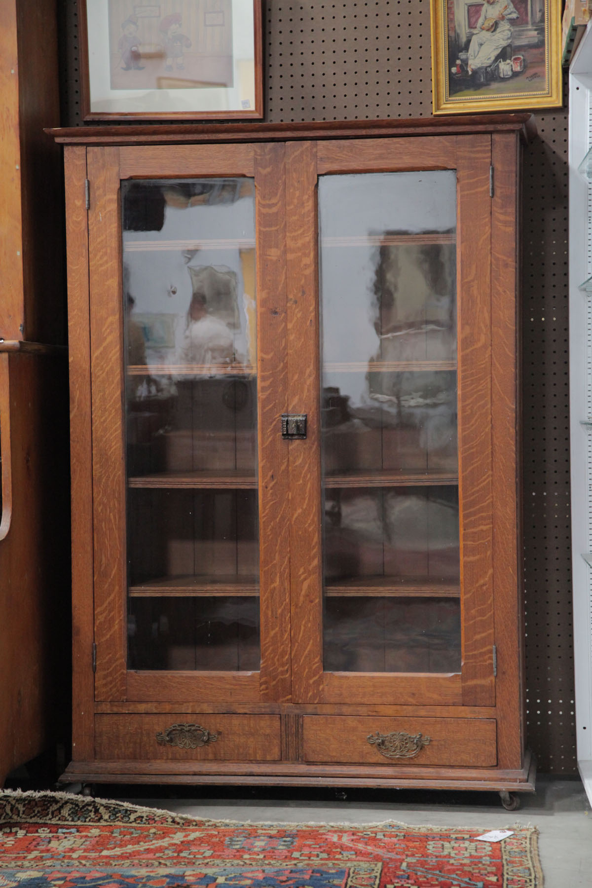 Appraisal: BOOKCASE American early th century Oak bookcase having two glazed