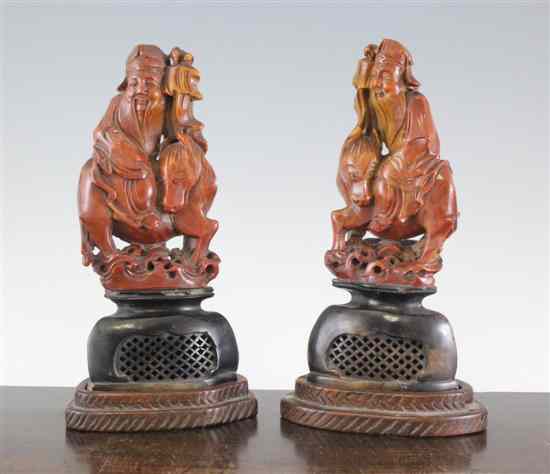 Appraisal: A pair of Chinese soapstone groups of an emperor on