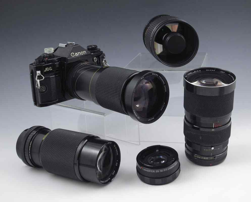 Appraisal: CANON A- CAMERA BODY WITH LENSES ACCESSORIES To include Cannon