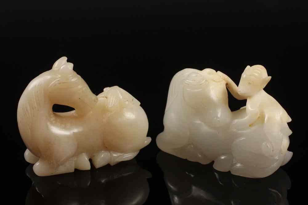 Appraisal: CHINESE JADE FIGURES - Two Chinese White Jade Figures of