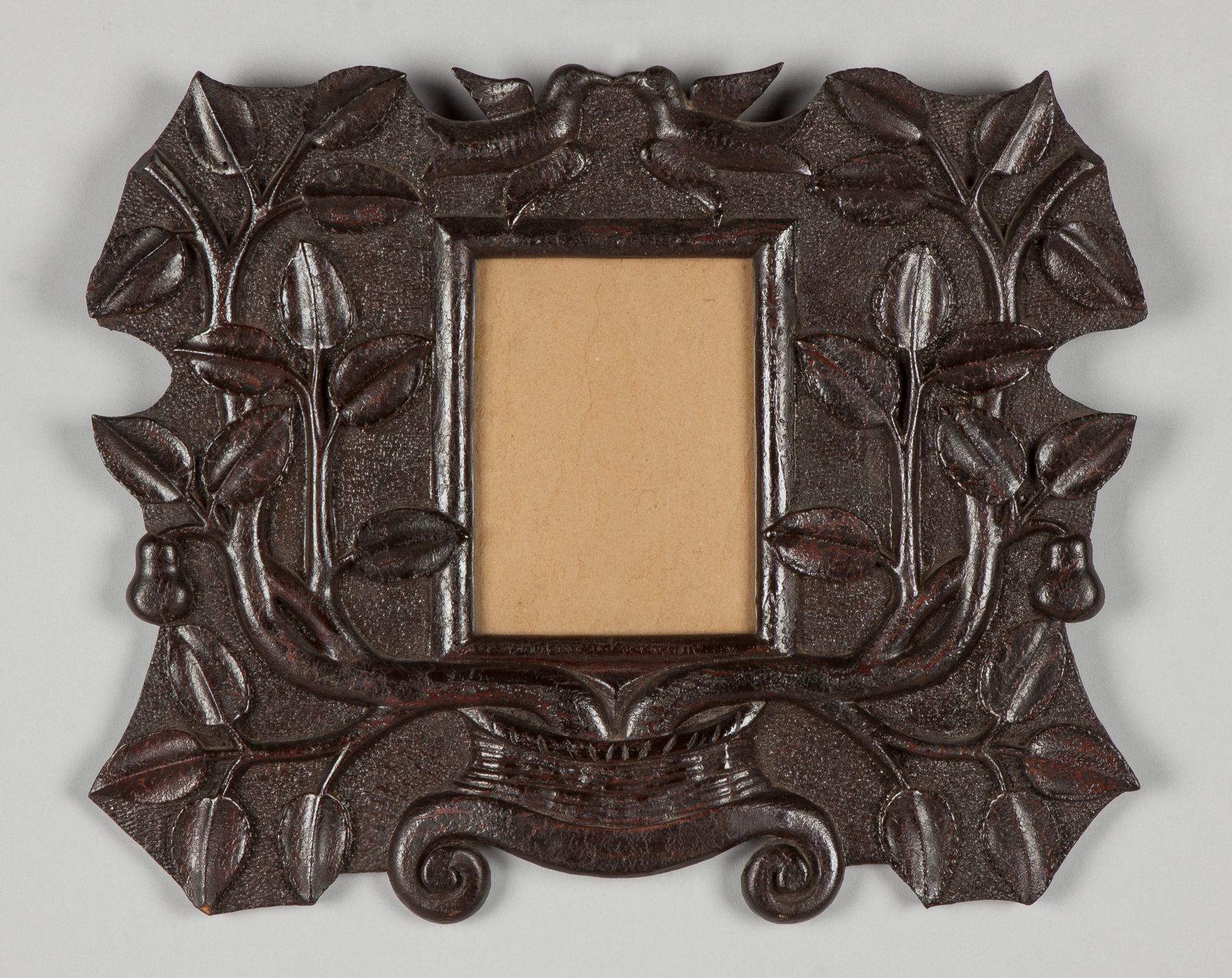 Appraisal: Folk Art Carved Wood Frame C With stylized basket pear