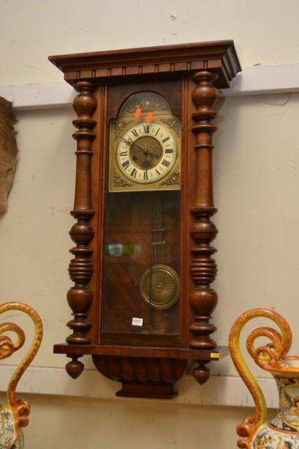 Appraisal: WALL CLOCK WITH AN ENAMELLED AND EMBOSSED BRASS DIAL