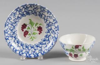 Appraisal: Blue sponge cup and saucer with berry decoration