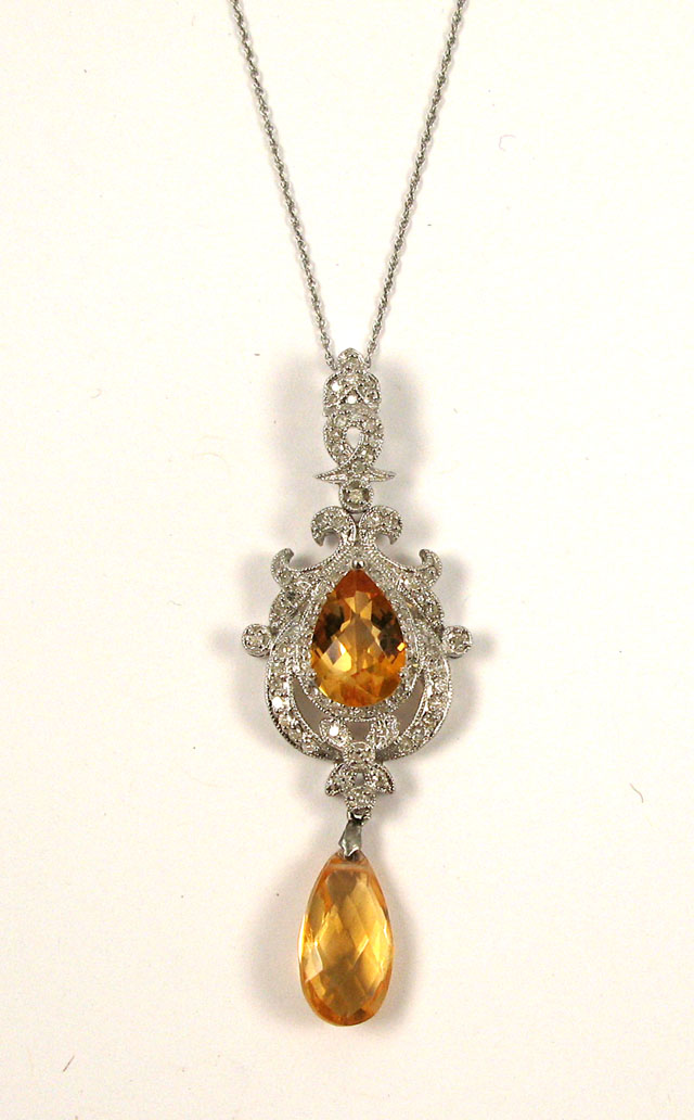 Appraisal: CITRINE AND DIAMOND PENDANT NECKLACE the pendant suspended on a