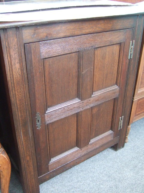 Appraisal: An th century style oak cupboard the three plank top