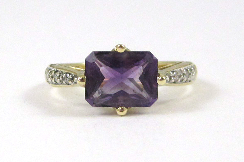 Appraisal: AMETHYST DIAMOND AND FOURTEEN KARAT GOLD RING with three round-cut