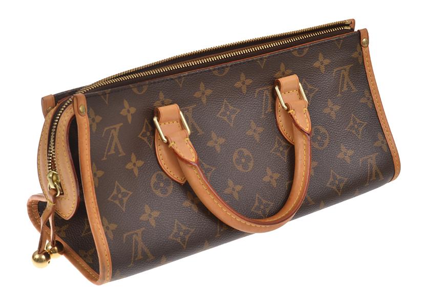 Appraisal: A HANDBAG BY LOUIS VUITTON Styled in Monogram canvas with