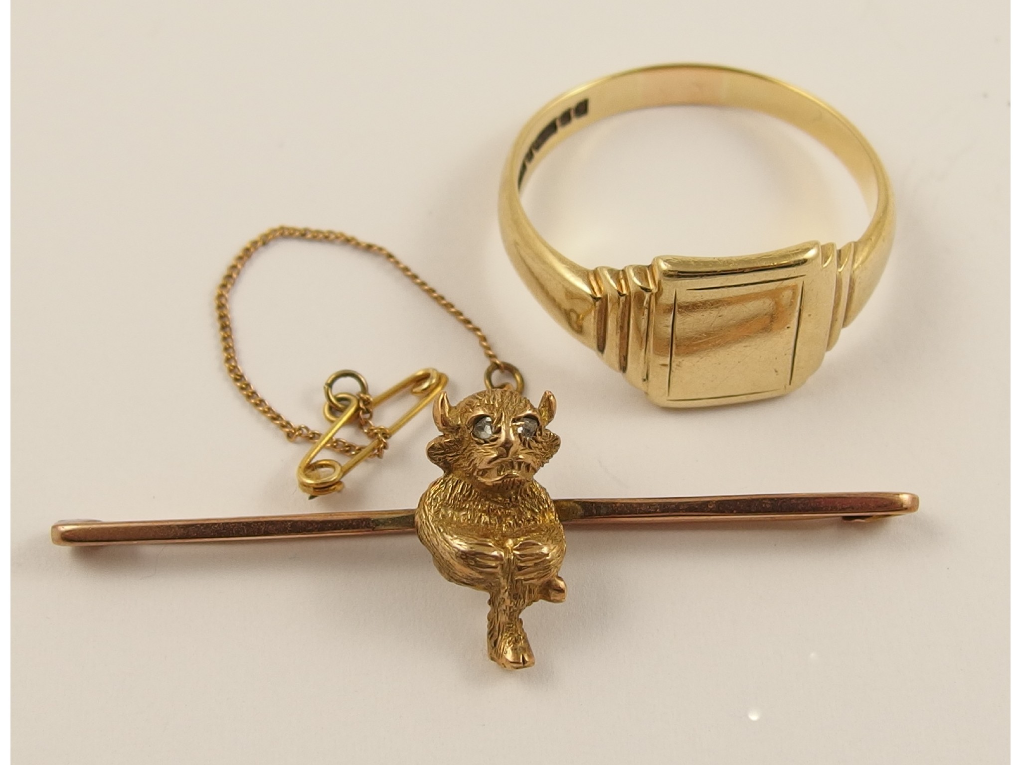 Appraisal: A ct Lincoln imp brooch and a ct gents signet