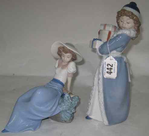 Appraisal: Nao Figures of a girl Carrying Presents and a Girl