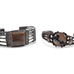 Appraisal: Navajo Silver and Petrified Wood Cuff Bracelets second quarter th