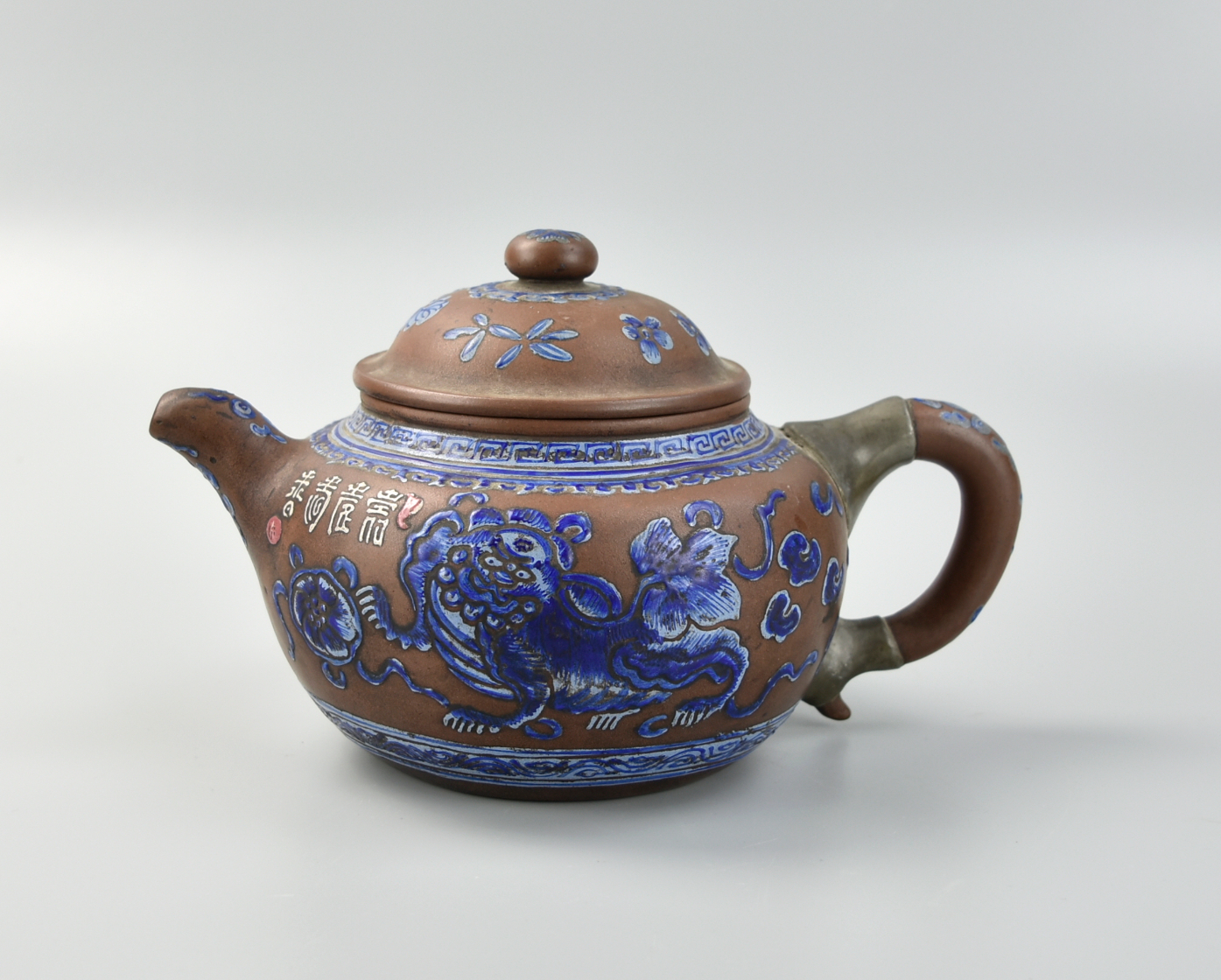 Appraisal: CHINESE YIXING ZISHA POTTERY GLAZED TEAPOT QING D Chinese late