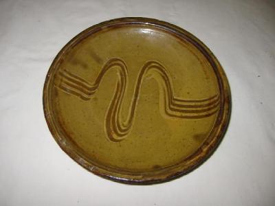 Appraisal: A STUDIO POTTERY PLATE by Michael Cardew of circular form