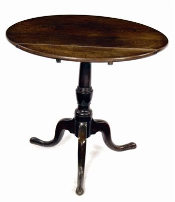 Appraisal: A George III oak tripod table the circular top to