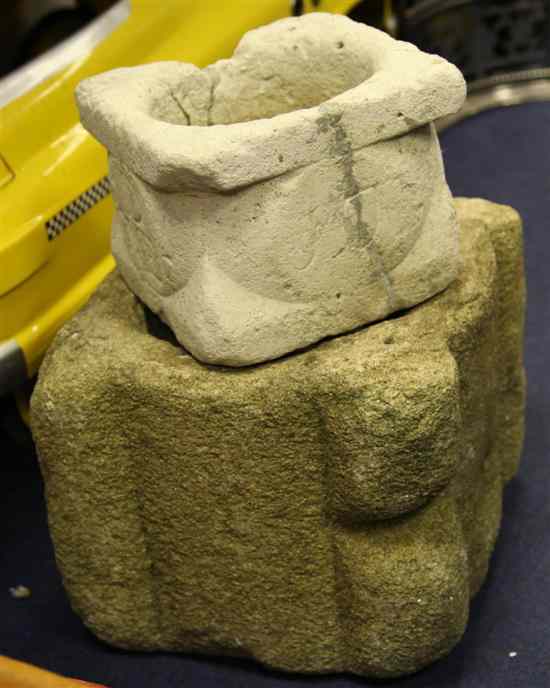 Appraisal: A th century carved granite mortar with a smaller limestone