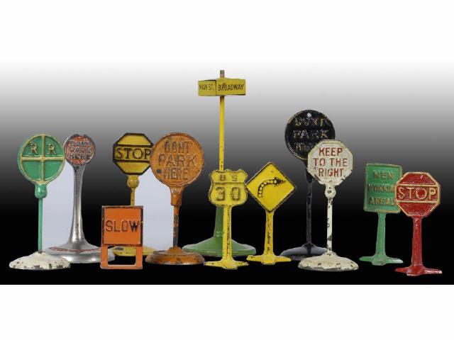 Appraisal: Lot of Cast Iron Tin Road Sign Accessories Description Various