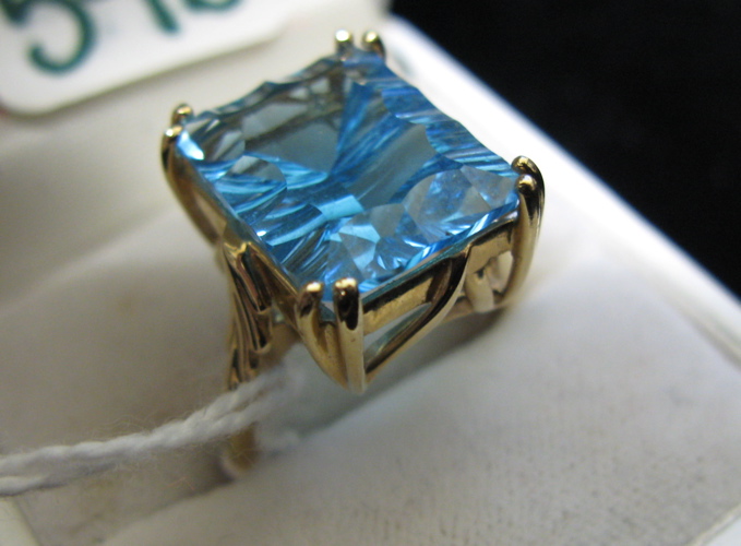 Appraisal: BLUE TOPAZ AND FOURTEEN KARAT GOLD RING set with a