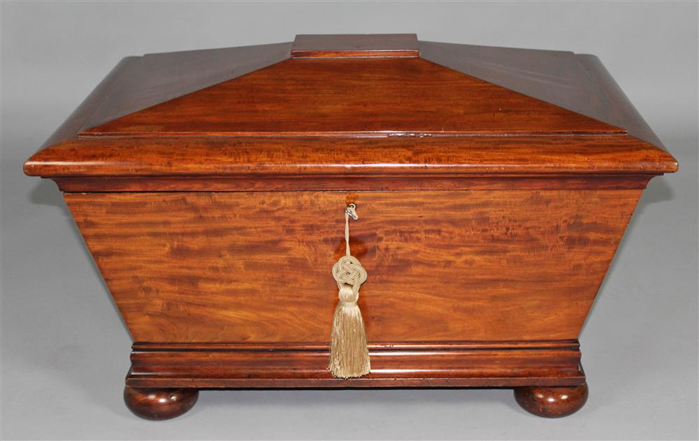 Appraisal: REGENCY MAHOGANY CELLARETTE WITH FITTED INTERIOR having a pyramid form