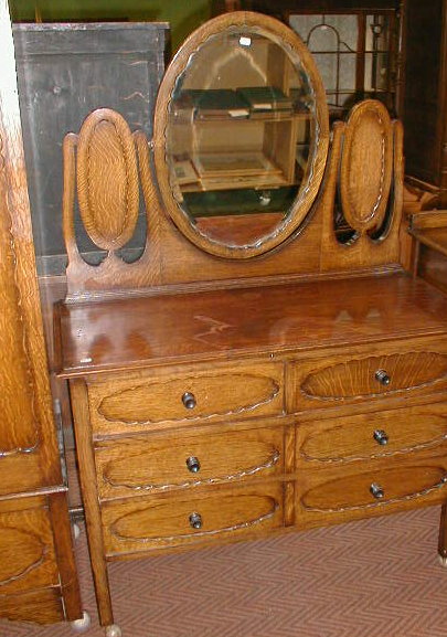 Appraisal: An oak three piece bedroom suite with moulded panel drawers