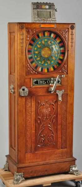 Appraisal: Mills Owl Upright Slot Machine Nice original tin lithograph wheel