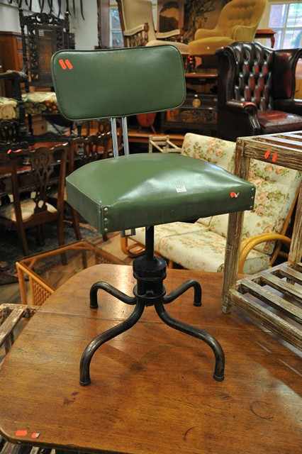 Appraisal: AN INDUSTRIAL GREEN VINYL SWIVEL CHAIR