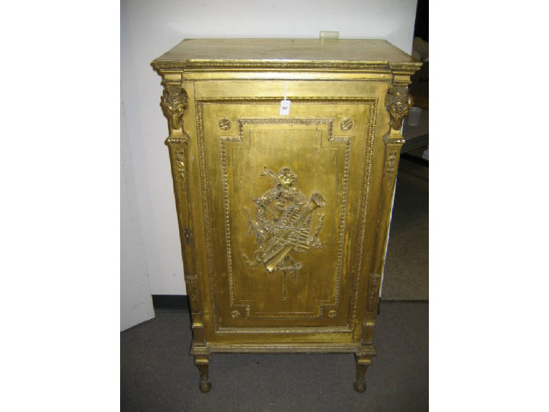 Appraisal: FRENCH GILT WOODEN MUSIC CABINET The shaped top over a