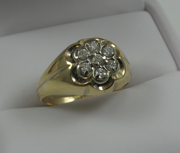 Appraisal: DIAMOND AND FOURTEEN KARAT GOLD RING set with seven round-cut